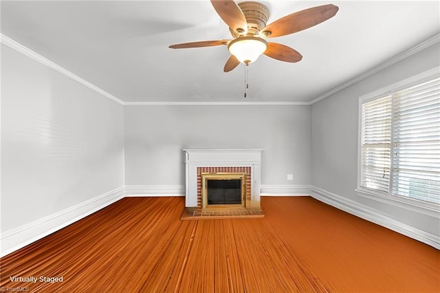 unfurnished living room with hardwood / wood-style floors, a fireplace, ornamental molding, and ceiling fan