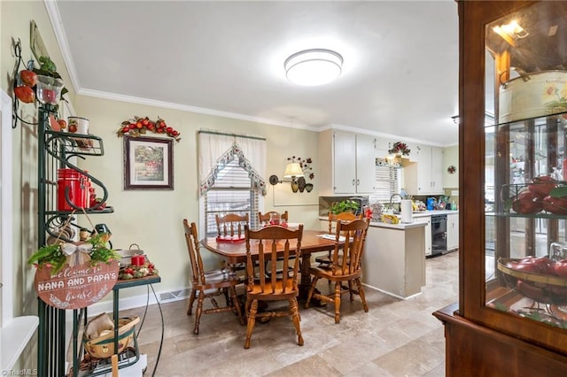 dining space with crown molding