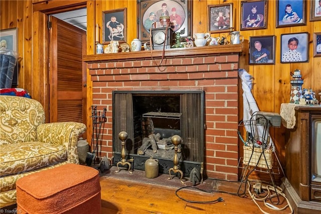 room details with a brick fireplace and wood walls