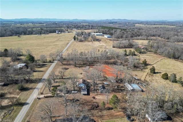 birds eye view of property with a rural view