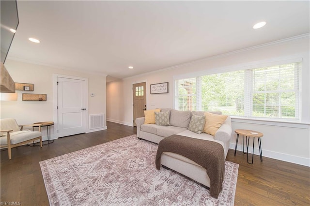 living area with crown molding, baseboards, dark wood-type flooring, and recessed lighting