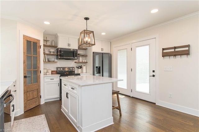 kitchen with appliances with stainless steel finishes, open shelves, white cabinets, light countertops, and crown molding