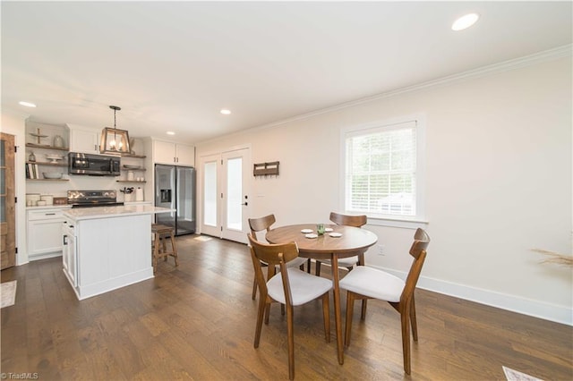 dining room featuring crown molding, dark wood finished floors, baseboards, and recessed lighting