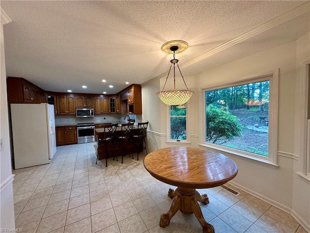3501 River Ridge Rd, Pfafftown, NC 27040 - dining room featuring a textured ceiling, light tile patterned flooring, recessed lighting, and baseboards
