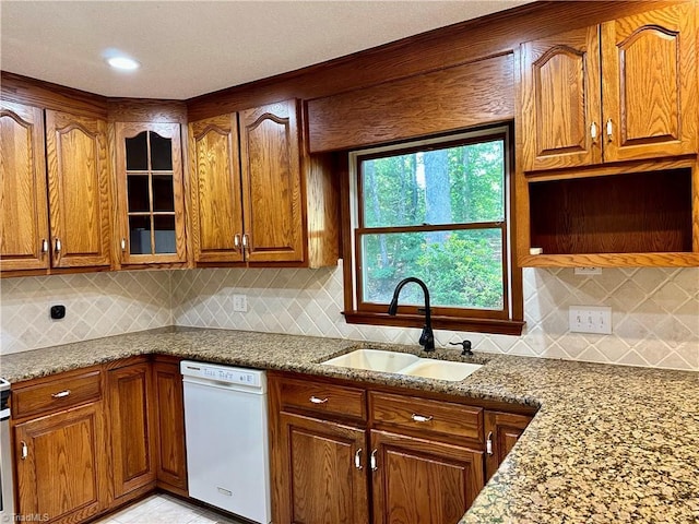 3501 River Ridge Rd, Pfafftown, NC 27040 - kitchen featuring white dishwasher, a sink, stone countertops, and glass insert cabinets