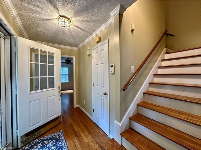 3501 River Ridge Rd, Pfafftown, NC 27040 - entryway featuring a textured ceiling, crown molding, stairway, wood finished floors, and ceiling fan