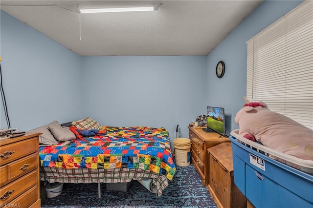 bedroom featuring a textured ceiling