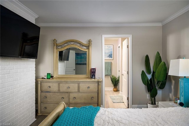 bedroom with wood-type flooring and ornamental molding