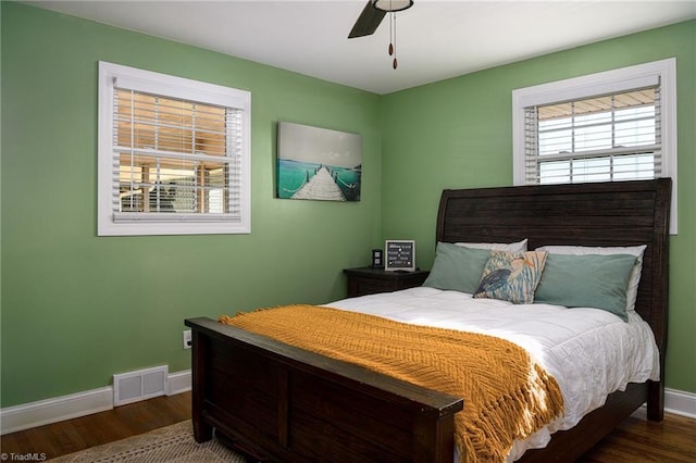 bedroom featuring ceiling fan and dark hardwood / wood-style floors