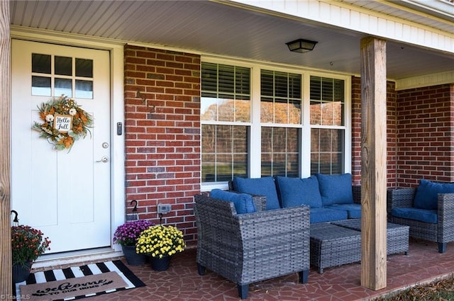 view of exterior entry featuring a porch