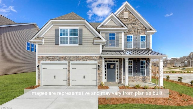 craftsman-style home with a garage and a front lawn