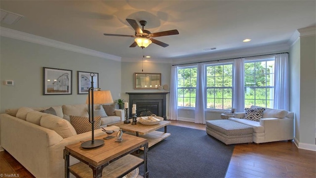 living room featuring ornamental molding, ceiling fan, and dark hardwood / wood-style floors