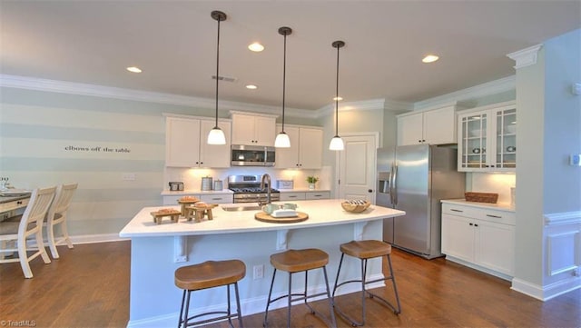 kitchen with stainless steel appliances, white cabinets, sink, and dark hardwood / wood-style flooring