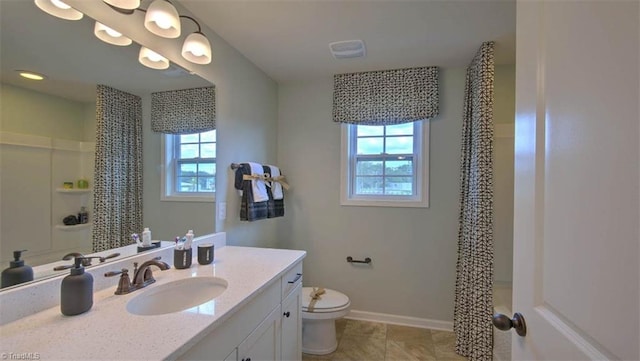 bathroom with vanity, tile patterned floors, toilet, and a shower with shower curtain