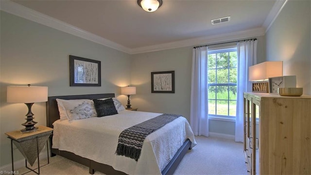 bedroom featuring ornamental molding and light carpet