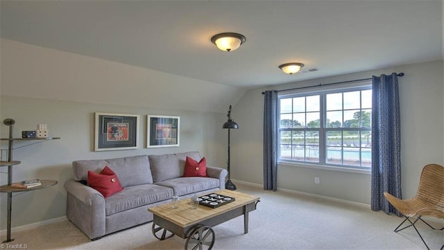 living room featuring light carpet and lofted ceiling