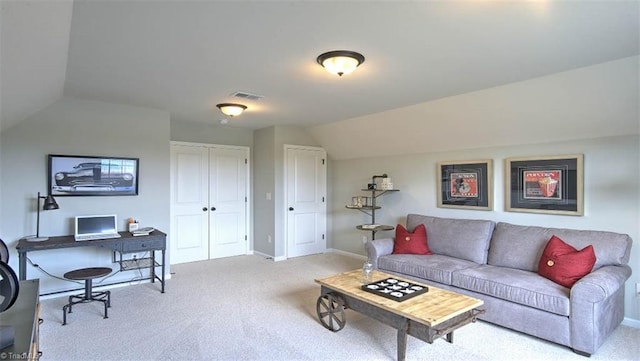 carpeted living room featuring lofted ceiling