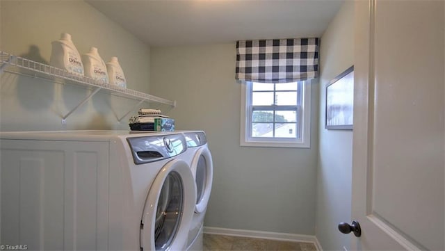 washroom with washing machine and clothes dryer