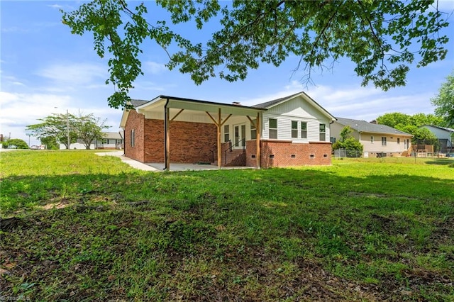 202 Aldridge Ln, Archdale, NC 27263 - rear view of house with a lawn, a patio, and brick siding