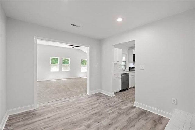 202 Aldridge Ln, Archdale, NC 27263 - spare room featuring a ceiling fan, light wood-style flooring, recessed lighting, baseboards, and a sink