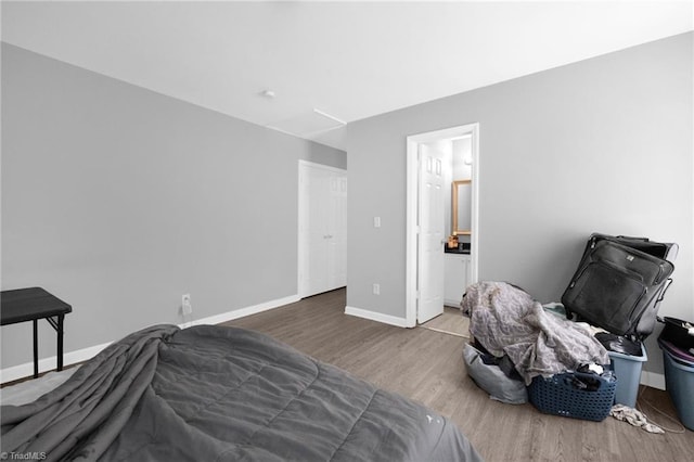 3304 Spring St, Greensboro, NC 27405 - bedroom featuring baseboards and wood finished floors