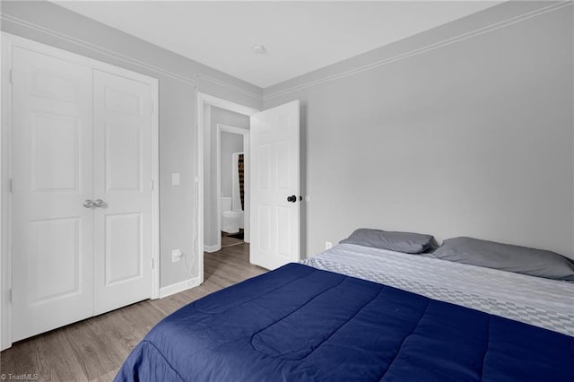 3304 Spring St, Greensboro, NC 27405 - bedroom featuring baseboards and wood finished floors