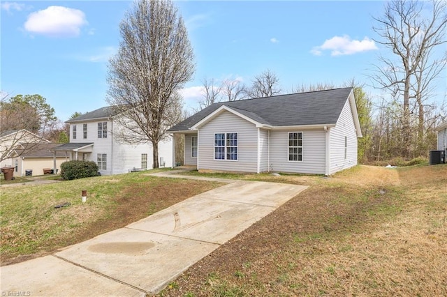 3304 Spring St, Greensboro, NC 27405 - view of front of home with central AC unit, roof with shingles, and a front lawn