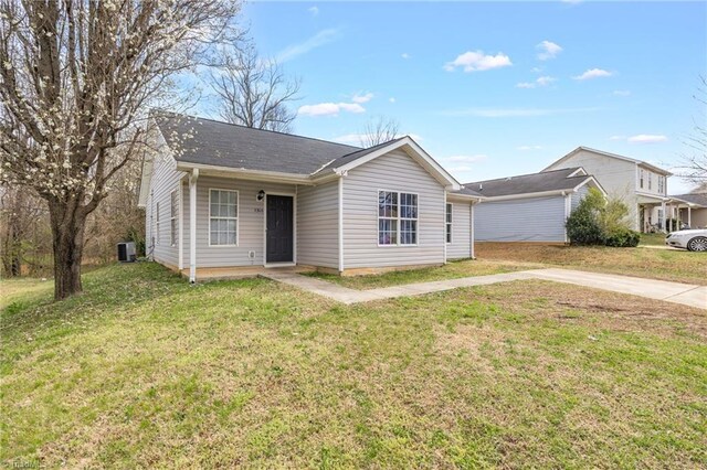 3304 Spring St, Greensboro, NC 27405 - view of front of property featuring a front lawn and cooling unit