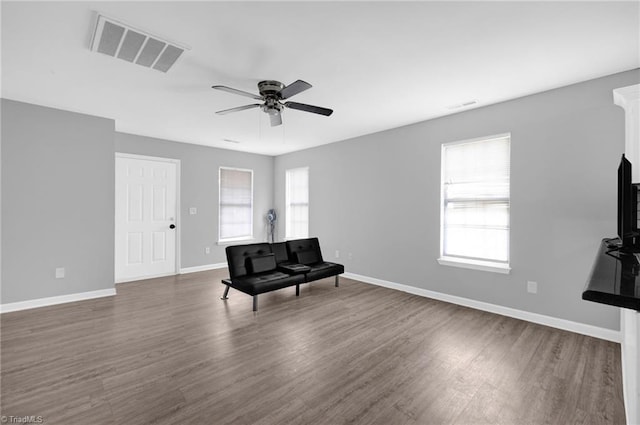 3304 Spring St, Greensboro, NC 27405 - unfurnished room featuring ceiling fan, a healthy amount of sunlight, visible vents, and dark wood-type flooring