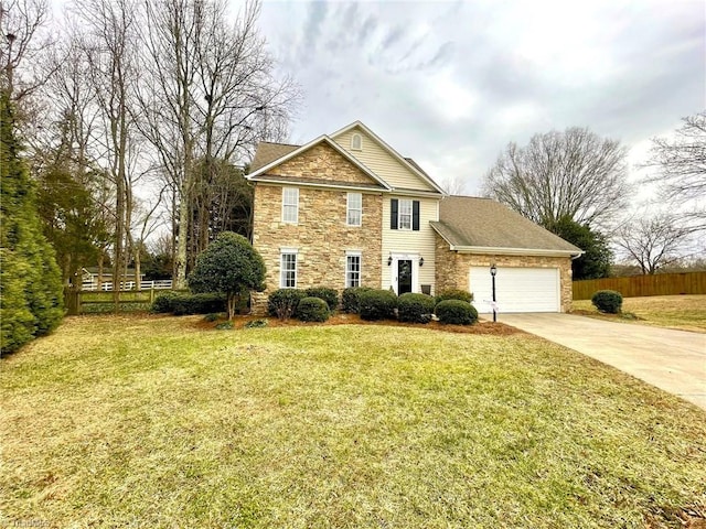 view of front of home with a garage and a front yard