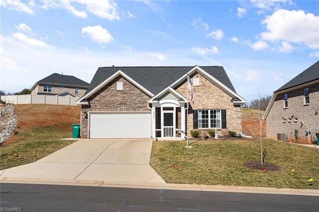 view of front of home featuring an attached garage, central air condition unit, brick siding, driveway, and a front yard