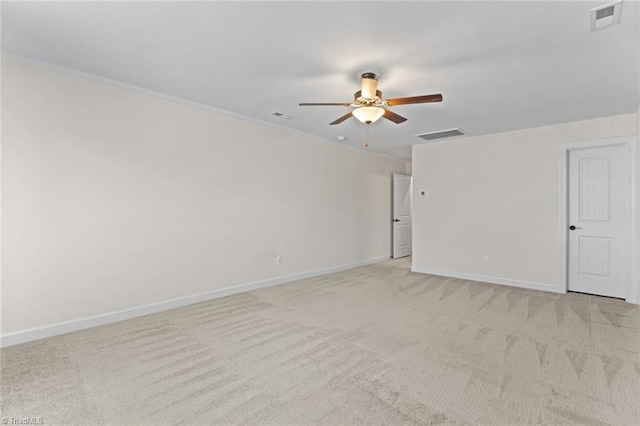 unfurnished room featuring light carpet, ceiling fan, visible vents, and baseboards