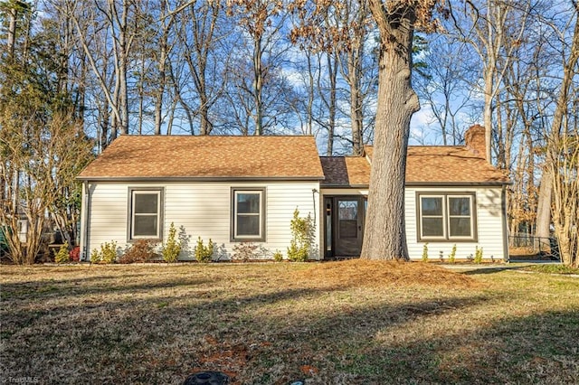 ranch-style home featuring a front yard