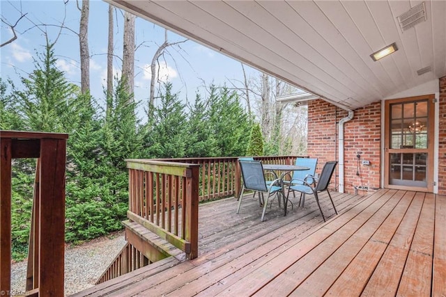 deck with visible vents and outdoor dining area