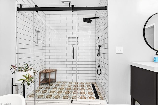 bathroom featuring a shower stall and vanity