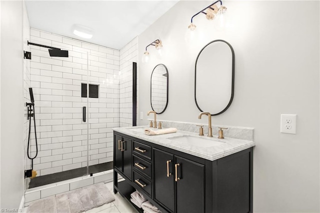 full bath featuring a shower stall, double vanity, and a sink