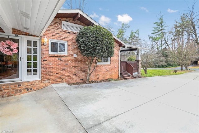 view of home's exterior with brick siding