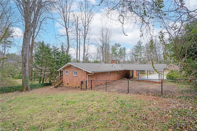 rear view of house with brick siding, crawl space, a lawn, and fence private yard