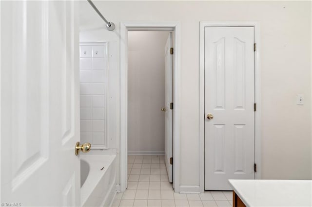 full bathroom featuring tile patterned floors, baseboards, and vanity