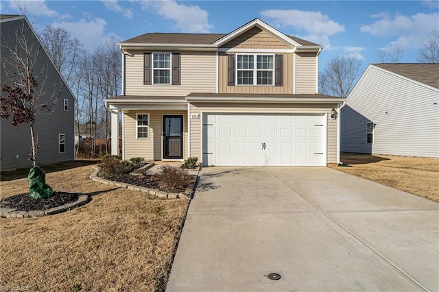 view of property featuring a garage and a front lawn