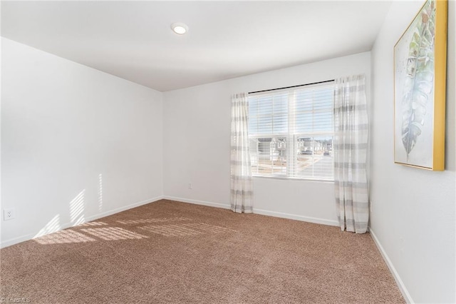 spare room featuring carpet flooring