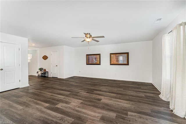 empty room with dark wood-type flooring and ceiling fan