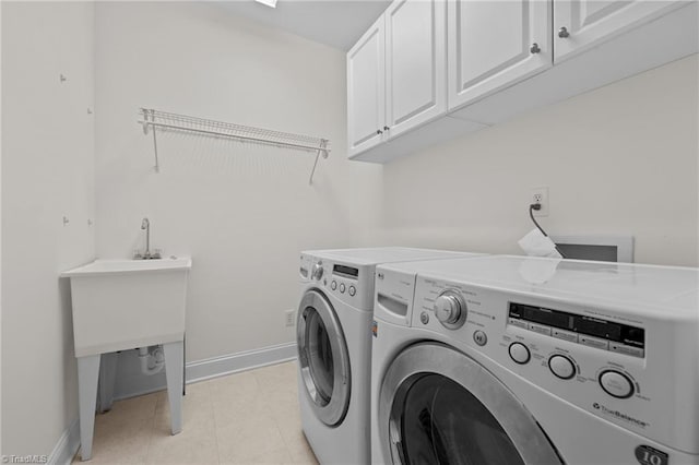 2014 Muirfield Ct, Elon, NC 27244 - laundry room with washer and clothes dryer, cabinet space, and baseboards