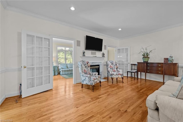 2014 Muirfield Ct, Elon, NC 27244 - living area with crown molding, light wood-style flooring, a high end fireplace, recessed lighting, and baseboards