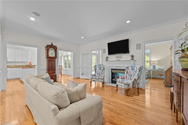 2014 Muirfield Ct, Elon, NC 27244 - living room with crown molding, a high end fireplace, light wood-type flooring, and recessed lighting