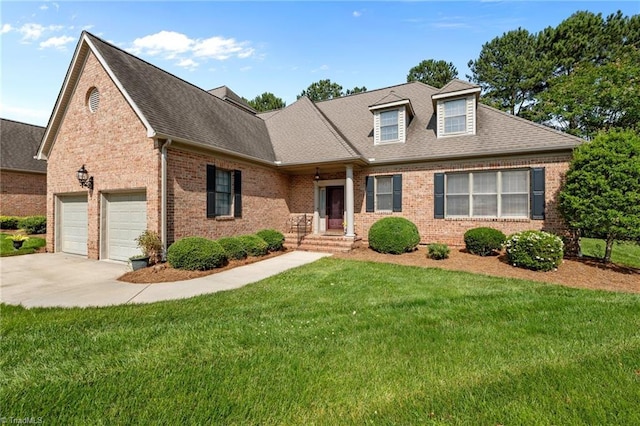 2014 Muirfield Ct, Elon, NC 27244 - view of front of property featuring brick siding, a front lawn, driveway, and a shingled roof