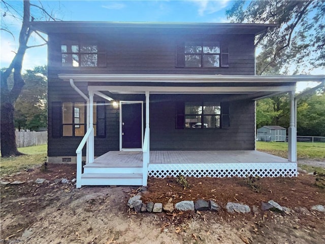 3877 Welcome Arcadia Rd, Lexington, NC 27295 - view of front of home with a storage unit, an outbuilding, a porch, and fence