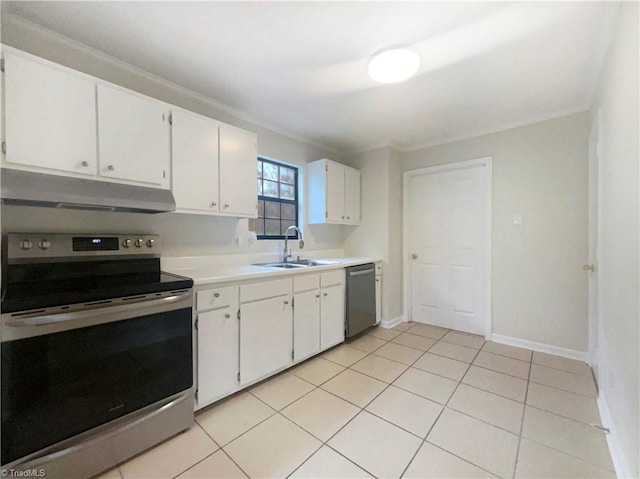 kitchen featuring stainless steel appliances, ornamental molding, sink, light tile patterned flooring, and white cabinetry