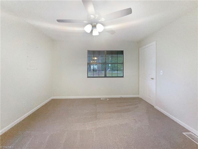 spare room with carpet and ceiling fan