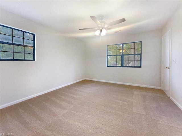 empty room with light carpet and ceiling fan